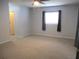 Relaxing bedroom showcasing neutral carpet and lots of natural light at 13816 Sw 112Th Ter, Dunnellon, FL 34432