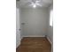 Cozy bedroom with hardwood floors, a ceiling fan, and natural light from a window at 13816 Sw 112Th Ter, Dunnellon, FL 34432