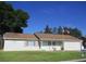 Charming home featuring a well-manicured lawn, and a two-car garage, topped off by an American flag at 13816 Sw 112Th Ter, Dunnellon, FL 34432