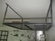 Ceiling-mounted storage rack in the garage for organization and space-saving at 13816 Sw 112Th Ter, Dunnellon, FL 34432