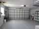 Spacious garage with an insulated garage door and epoxy flooring at 13816 Sw 112Th Ter, Dunnellon, FL 34432