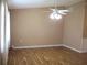 The expansive living room features laminate flooring, natural light, and ceiling fan at 13816 Sw 112Th Ter, Dunnellon, FL 34432