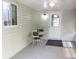 Sunroom with a small table and chairs, featuring a window and glass panel door at 13816 Sw 112Th Ter, Dunnellon, FL 34432