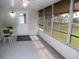 Bright sunroom with multiple windows, a glass door, and outdoor views at 13816 Sw 112Th Ter, Dunnellon, FL 34432