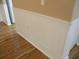 Detailed white wainscoting is complemented by durable wood-look floors at 13816 Sw 112Th Ter, Dunnellon, FL 34432