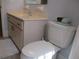 Bathroom showcasing a toilet, a single sink vanity, and tile flooring at 14272 Sw 112Th Cir, Dunnellon, FL 34432