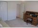 Bedroom featuring a desk, a closet, and a comfortable sofa at 14272 Sw 112Th Cir, Dunnellon, FL 34432