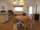Cozy dining area with wooden table, seating, and ample natural light at 14272 Sw 112Th Cir, Dunnellon, FL 34432