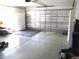 Spacious garage with insulated garage door and epoxy floor at 14272 Sw 112Th Cir, Dunnellon, FL 34432