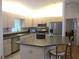 Bright kitchen featuring stainless steel appliances, stone countertops and ample cabinet space at 14272 Sw 112Th Cir, Dunnellon, FL 34432