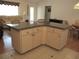 Spacious kitchen island featuring granite countertops and ample cabinet space, perfect for entertaining at 14272 Sw 112Th Cir, Dunnellon, FL 34432