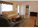 Inviting living room with comfortable seating, natural light, and hardwood floors at 14272 Sw 112Th Cir, Dunnellon, FL 34432