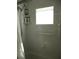 Shower featuring a showerhead, grab bar, corner shelves, and a window for natural light at 14272 Sw 112Th Cir, Dunnellon, FL 34432