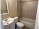 Cozy bathroom featuring a tiled shower-tub combo and vanity at 15036 Sw 35Th Cir, Ocala, FL 34473