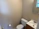 Compact half bathroom with toilet and modern vanity at 15036 Sw 35Th Cir, Ocala, FL 34473