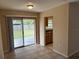 Dining area with tile flooring and sliding glass doors to the backyard at 15036 Sw 35Th Cir, Ocala, FL 34473