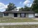 Charming single-story home featuring a well-kept lawn and classic design elements at 15036 Sw 35Th Cir, Ocala, FL 34473