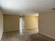 Spacious living area featuring tile and carpet flooring, leading to other rooms in the home at 15036 Sw 35Th Cir, Ocala, FL 34473