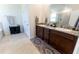 Spacious bathroom with double vanity, granite countertop, and separate shower and tub at 1509 Ne 50Th Ter, Ocala, FL 34470