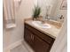 Powder room features a sleek vanity, modern faucet, towel, and stylish decor at 1509 Ne 50Th Ter, Ocala, FL 34470