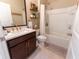 Stylish bathroom features a sleek vanity, modern fixtures, and tiled shower at 1509 Ne 50Th Ter, Ocala, FL 34470