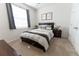 Serene bedroom with neutral colors, a comfortable bed, and modern decor at 1509 Ne 50Th Ter, Ocala, FL 34470