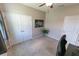 Bedroom features a closet, modern art, ceiling fan and plush carpet at 1509 Ne 50Th Ter, Ocala, FL 34470