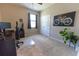 Bedroom features plush carpet, closet, modern art, ceiling fan and a window at 1509 Ne 50Th Ter, Ocala, FL 34470
