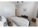 Bright bedroom features plush carpet, ceiling fan, closet and white neutral walls at 1509 Ne 50Th Ter, Ocala, FL 34470