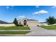 Charming single-story home features a well-manicured lawn, a two car garage, and a lovely front door at 1509 Ne 50Th Ter, Ocala, FL 34470