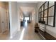 Spacious foyer with tile floors and multiple doorways leading to other areas of this beautiful home at 1509 Ne 50Th Ter, Ocala, FL 34470