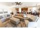 Spacious living room showcasing an open floor plan with comfortable furnishings, and connection to kitchen at 1509 Ne 50Th Ter, Ocala, FL 34470