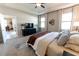 Comfortable main bedroom featuring a ceiling fan, neutral colors, and doorway to dining room at 1509 Ne 50Th Ter, Ocala, FL 34470