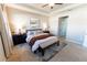 Bright main bedroom with tray ceiling, large windows, and contemporary decor at 1509 Ne 50Th Ter, Ocala, FL 34470