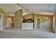 Large living room with neutral colored walls, carpeted floors, and a modern lighting at 1551 Sw Willow Road Ext, Dunnellon, FL 34431