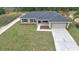Aerial view of a single-story home with large yard, highlighting its neighborhood setting at 16219 Sw 48Th Cir, Ocala, FL 34473