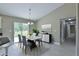 Bright dining area with modern decor, table, and sliding doors to the backyard at 16219 Sw 48Th Cir, Ocala, FL 34473