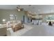 Expansive open living space with modern kitchen, dining area, and comfortable seating at 16219 Sw 48Th Cir, Ocala, FL 34473