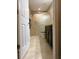 Bathroom features a glass shower door, grab bars, neutral tile, and a dark vanity with a granite countertop at 20386 Sw 95Th St, Dunnellon, FL 34431