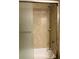 Bathroom features a shower and tub combo with beige tile surround at 20386 Sw 95Th St, Dunnellon, FL 34431