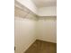 Empty walk in closet with carpet and wire shelving at 20386 Sw 95Th St, Dunnellon, FL 34431