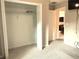 A standard closet with wire shelving, seen from the interior of a carpeted bedroom at 20386 Sw 95Th St, Dunnellon, FL 34431