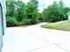 Circular driveway leading to wooded area of this secluded property at 20386 Sw 95Th St, Dunnellon, FL 34431