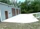 Spacious garage with three roll-up doors and a side entry offers plenty of room for parking and storage at 20386 Sw 95Th St, Dunnellon, FL 34431