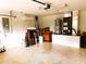 Spacious garage with speckled epoxy flooring, storage, and mini-split A/C unit at 20386 Sw 95Th St, Dunnellon, FL 34431