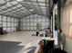 Spacious garage/workshop with high ceilings, steel beam construction, and roll-up doors at 20386 Sw 95Th St, Dunnellon, FL 34431