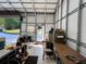 Garage interior with workbench and rear entry at 20386 Sw 95Th St, Dunnellon, FL 34431