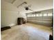 Spacious two-car garage with speckled flooring, overhead lighting, and an automatic door opener at 20386 Sw 95Th St, Dunnellon, FL 34431