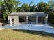 Exterior view of three-door garage with open doors at 20386 Sw 95Th St, Dunnellon, FL 34431