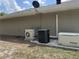 Exterior view of home's HVAC, with a Mitsubishi AC unit, Goodman AC, and a Generac backup generator at 20386 Sw 95Th St, Dunnellon, FL 34431